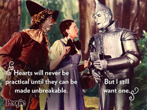 From left: Scarecrow (Ray Bolger), Dorothy (Judy Garland) and Tin Man ...
