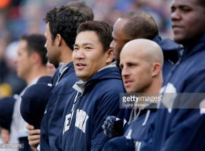 News Photo : Masahiro Tanaka of the New York Yankees lines up...