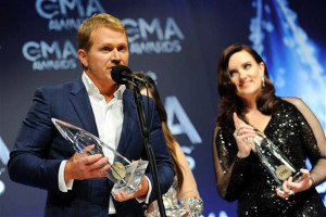 Shane McAnally left and Brandy Clark pose in the press room with the