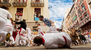 Pamplona Running with the Bulls / Photo by Migel via Shutterstock