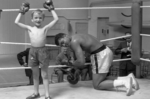 Cassius Clay with 6 years old Patrick Power in the ring during his ...