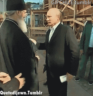 Putin reacts to another man kissing his hand