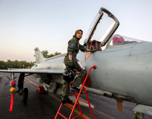 war-ready fighter pilot, climbs up to a Chinese-made F-7PG fighter ...