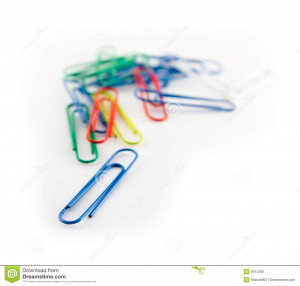 Stack of paper clips on white background.