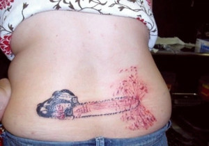 chainsaw tramp stamp, bad tattoo photos, pics, worst tattoos ever ...